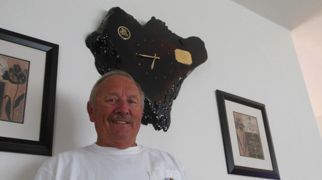 Tom Wyatt today with his redwood burl slap trophy won for being Track Champion at Redwood Acres in 1976